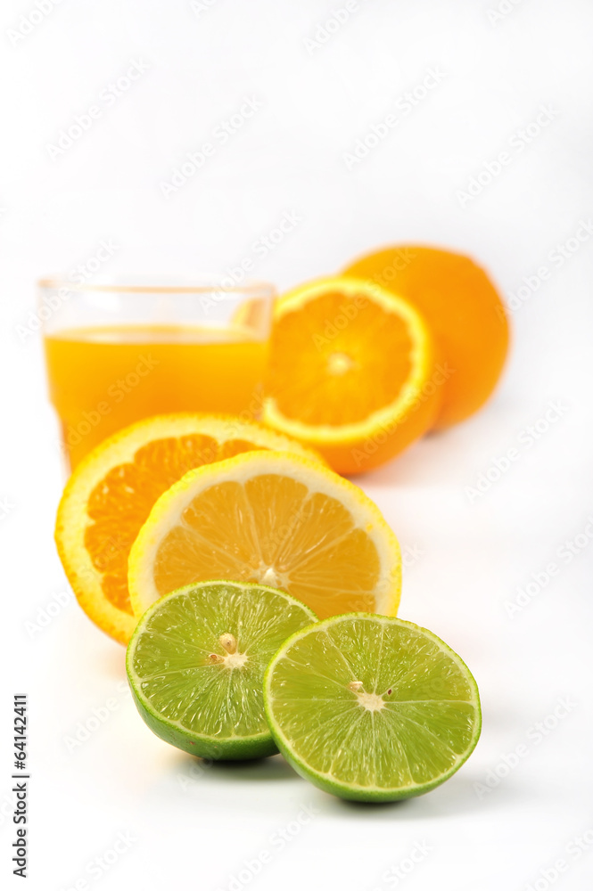 Orange juice and slices of orange and lemonade isolated on white Orange juice and slices of orange and lemonade isolated on white