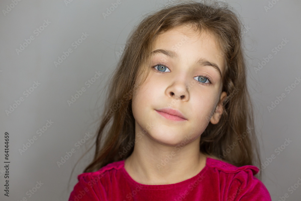 Portrait of little girl in red sweater in studio Portrait of little girl in red sweater in studio