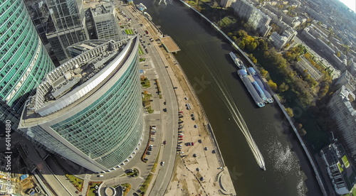 Cityscape and boat on the river