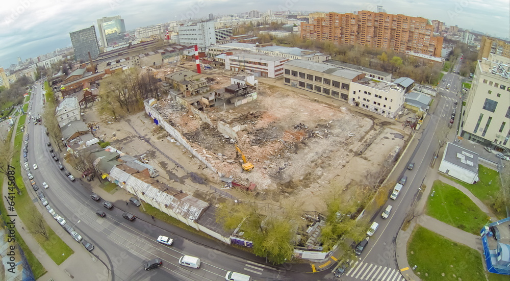 Fototapeta premium Destruction of old buildings to build housing complex