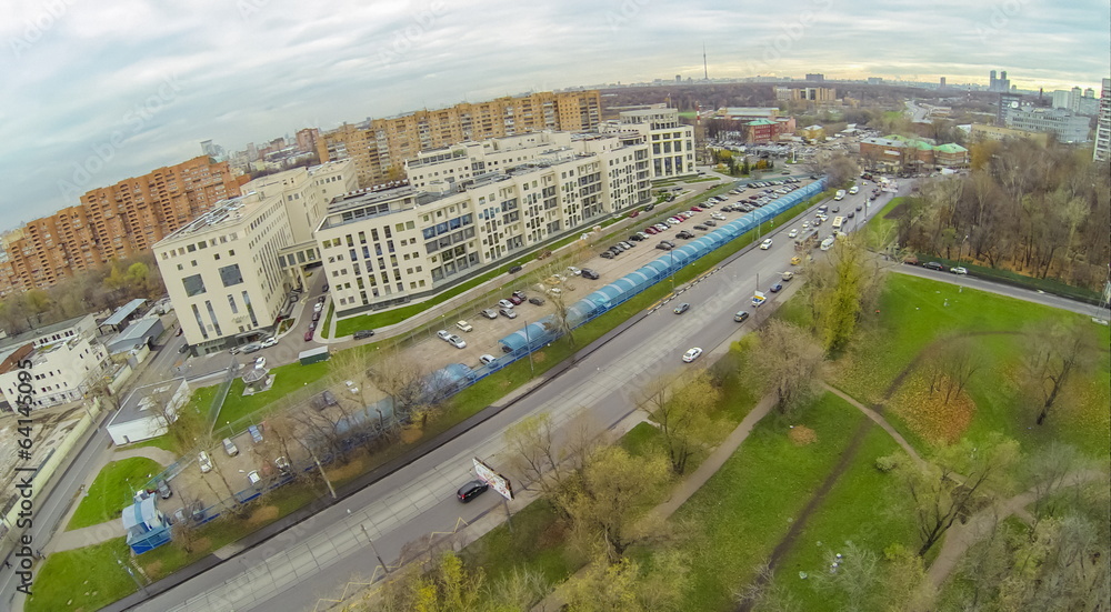 Obraz premium long car parking with plastic cover near residential house