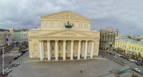 View from unmanned quadrocopter to Theatre with car traffic