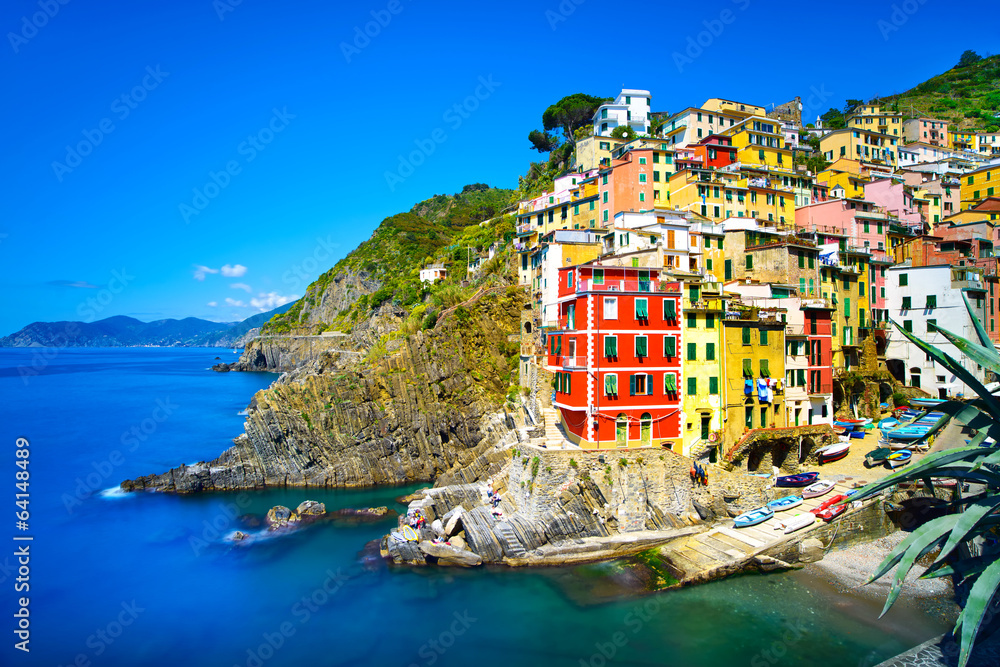 Riomaggiore village, rocks and sea at sunset. Cinque Terre, Ligu