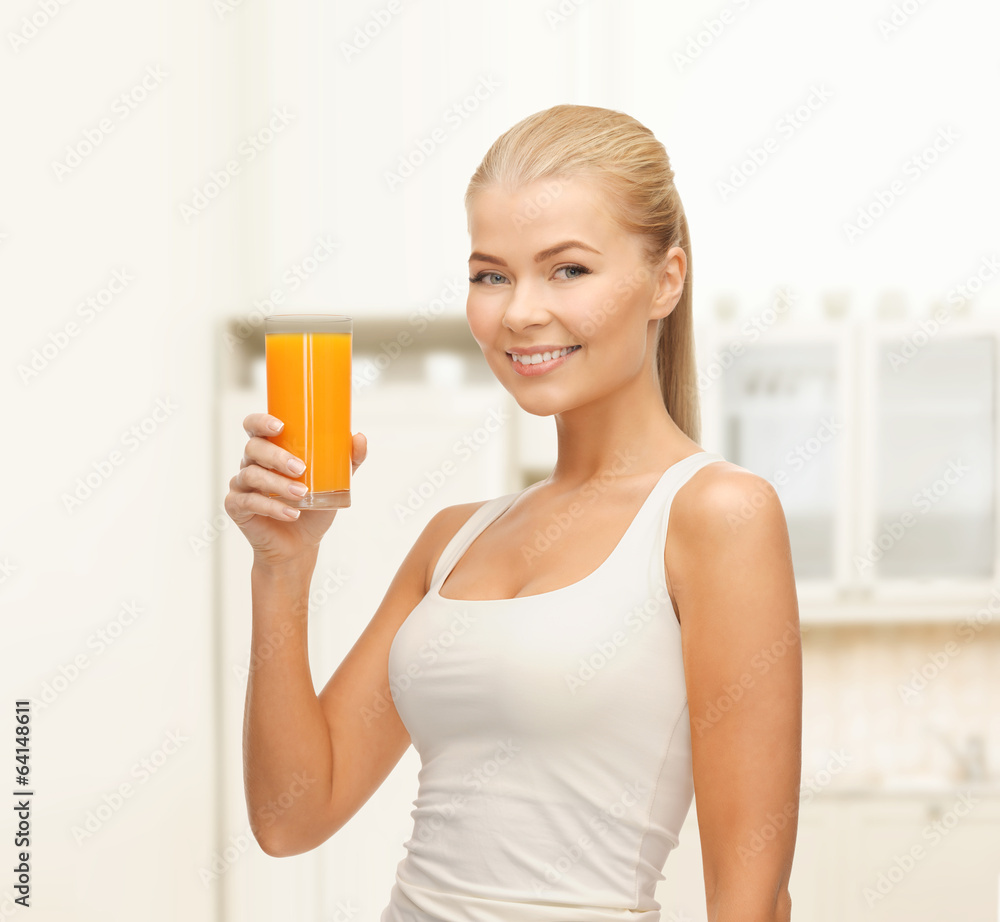 smiling woman holding glass of orange juice smiling woman holding glass of orange juice