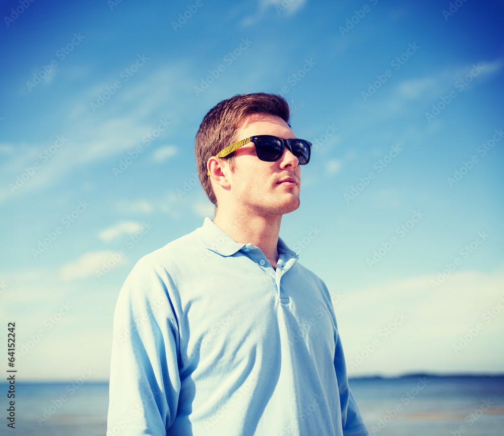 man in sunglasses on the beach man in sunglasses on the beach