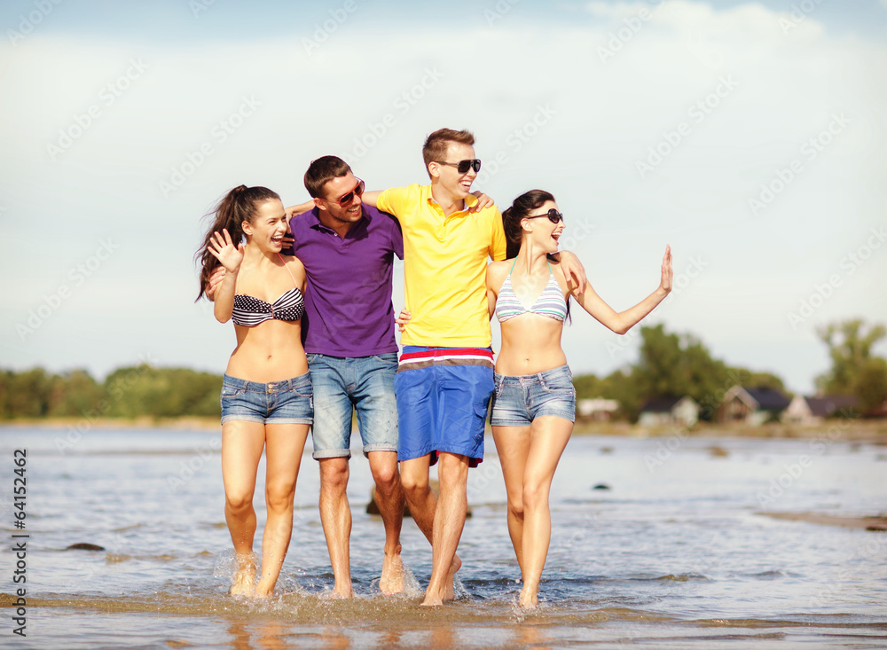 group of friends having fun on the beach group of friends having fun on the beach
