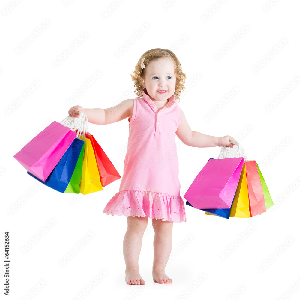 Little girl with curly hair wearing pink dress after sale