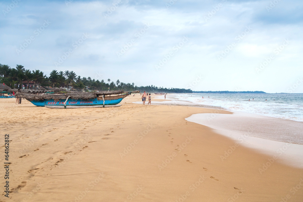 Tourists enjoys walking and swimming at Hikkaduwa beach