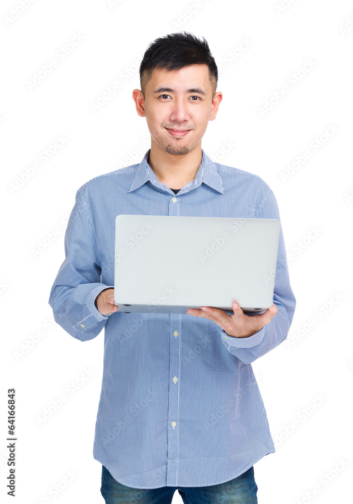 Asian man holding laptop computer Asian man holding laptop computer