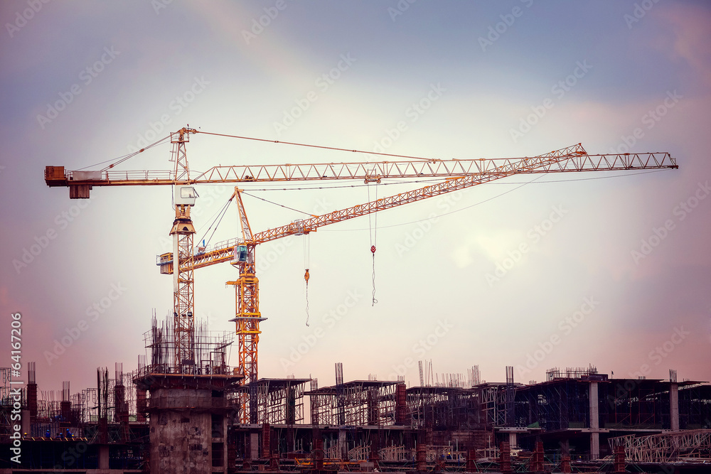 Construction site with cranes and scaffolding