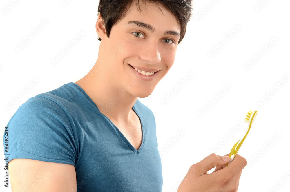 Man with beautiful teeth smiling and holding a toothbrush. Man with beautiful teeth smiling and holding a toothbrush.