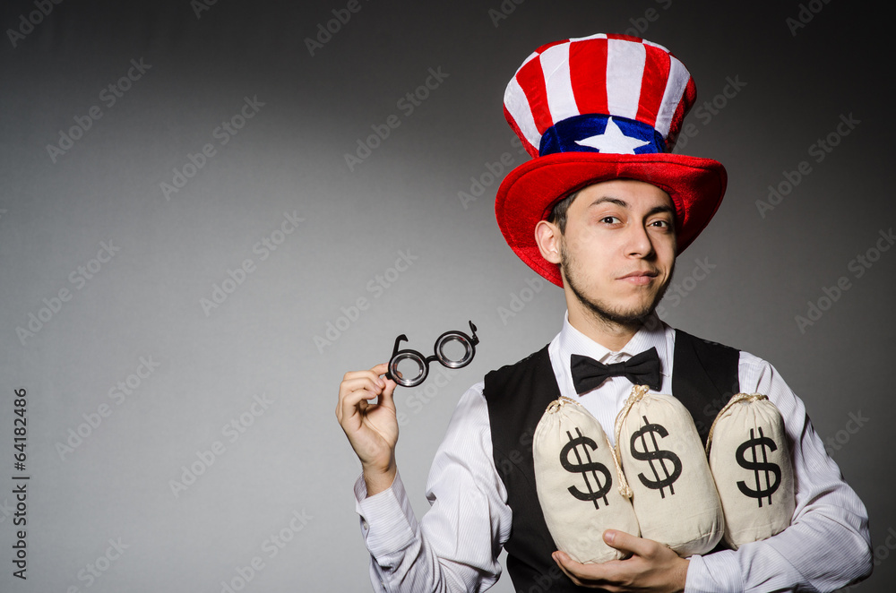 Funny man with american hat and sacks of money Funny man with american hat and sacks of money