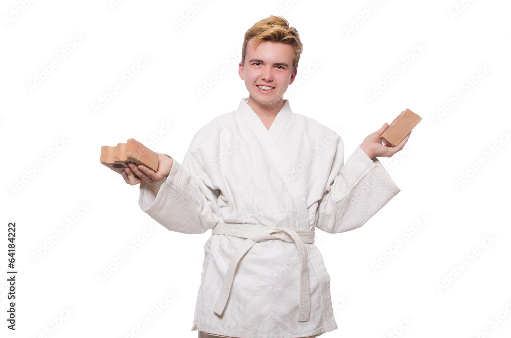 Funny karate man breaking bricks isolated on white Funny karate man breaking bricks isolated on white