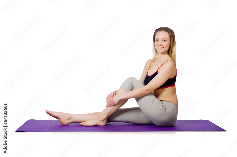 Young female doing exercises on white