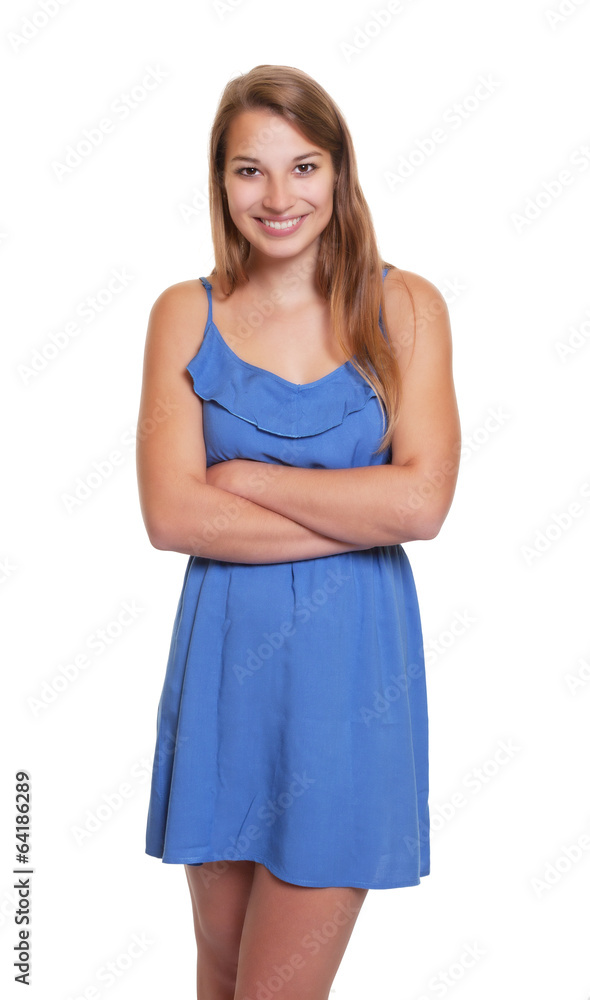 Woman with crossed arms in a blue summer dress Woman with crossed arms in a blue summer dress