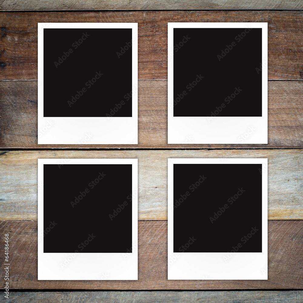 Polaroid photo frame on wood background Polaroid photo frame on wood background