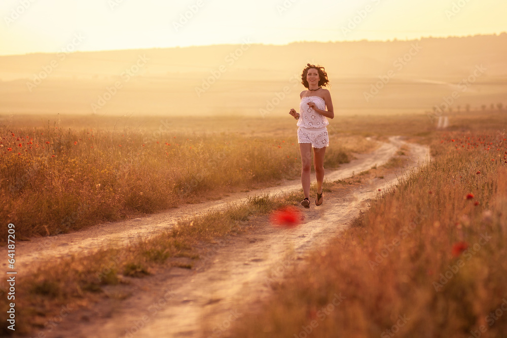 A woman in the poppy field