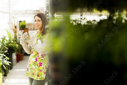 Young woman in flower garden
