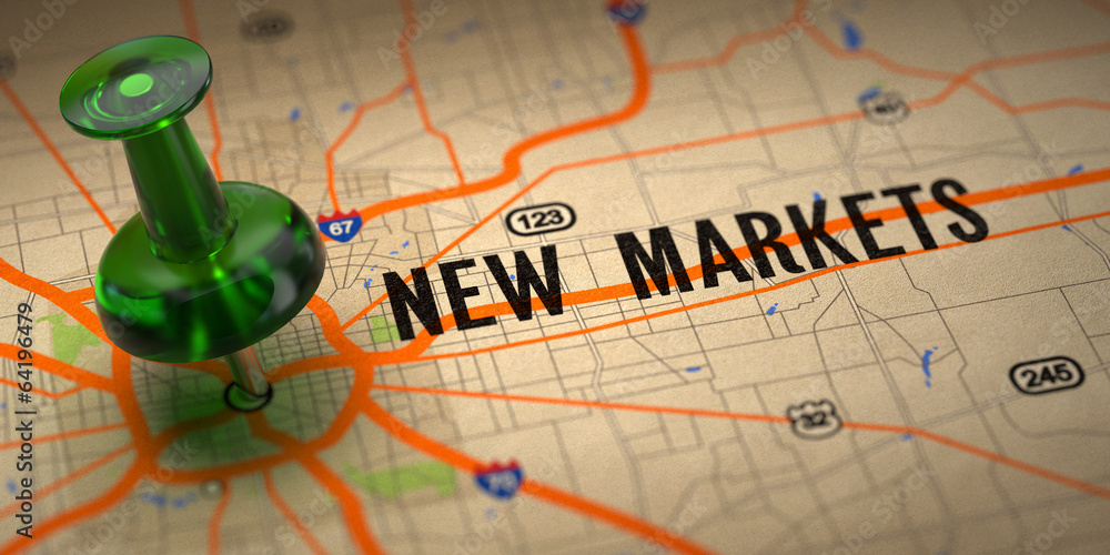 Fotografie New Markets - Green Pushpin on a Map Background.