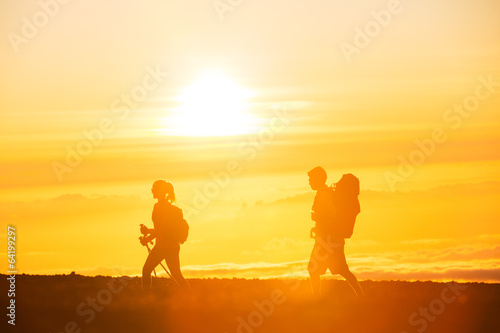 Hikers with Backpacks at Sunset