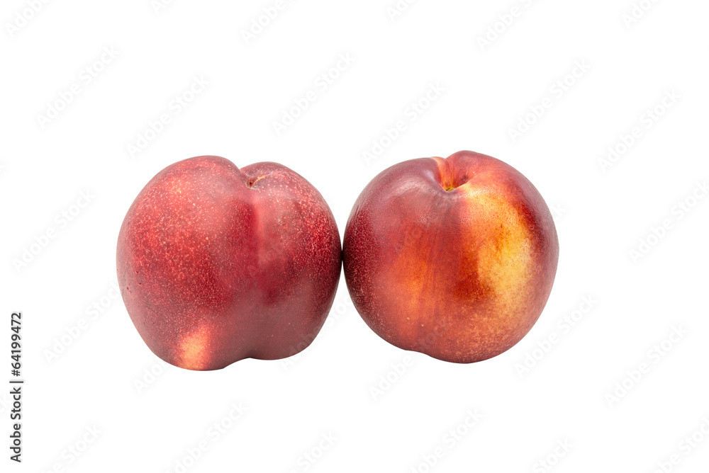 Obraz premium Two nectarines on white background