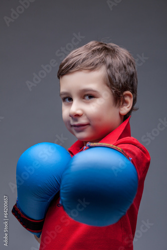 Slyly smiling young boxer posing looking at camera © Wisky