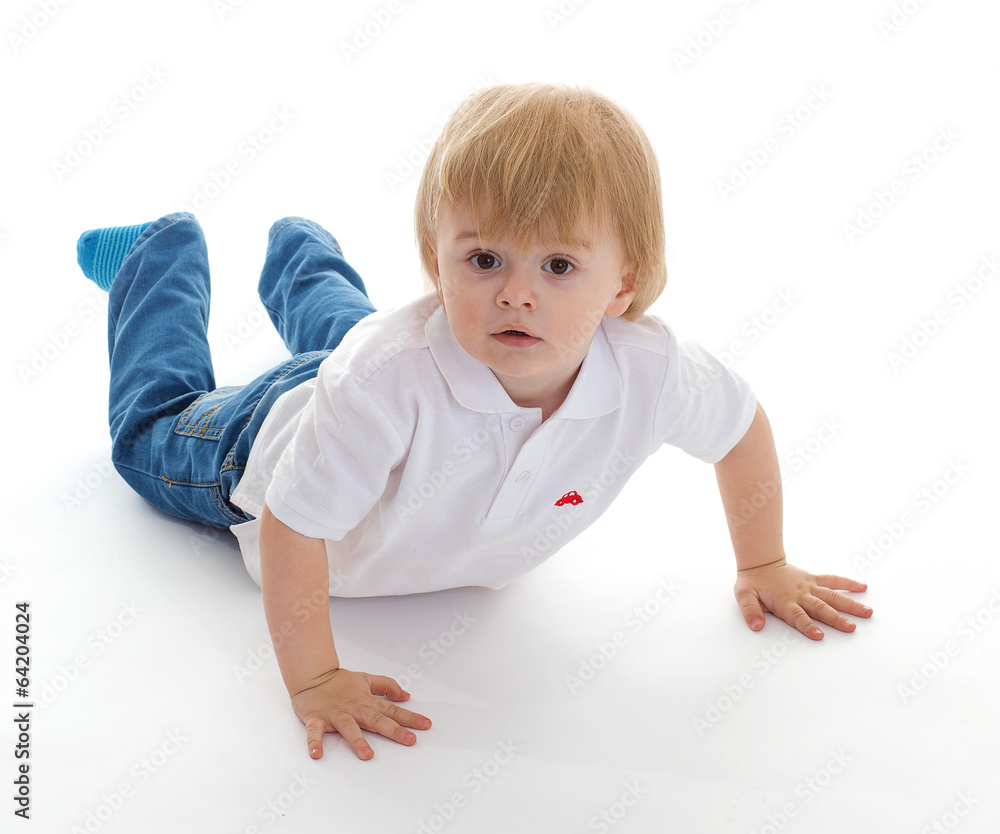 Portrait of a cute little boy lying on floor Portrait of a cute little boy lying on floor