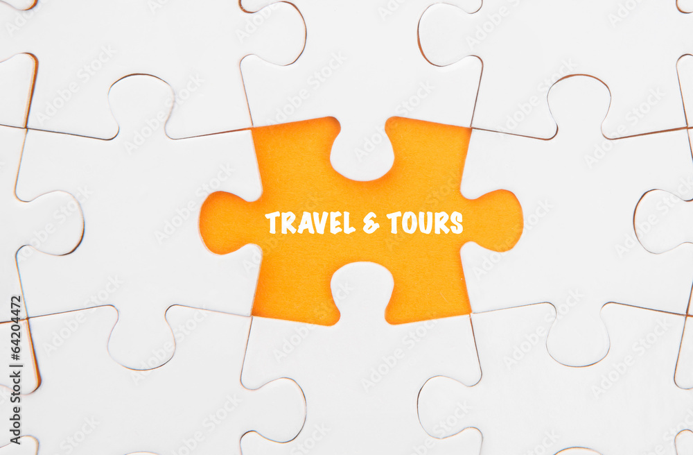 Fototapeta premium Missing piece of jigsaw puzzle revealing the TRAVEL & TOURS word