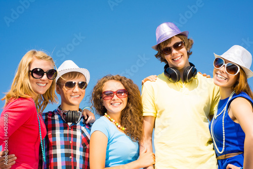 group of young people wearing sunglasses and hat