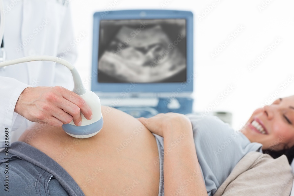 Pregnant woman undergoing ultrasound Pregnant woman undergoing ultrasound