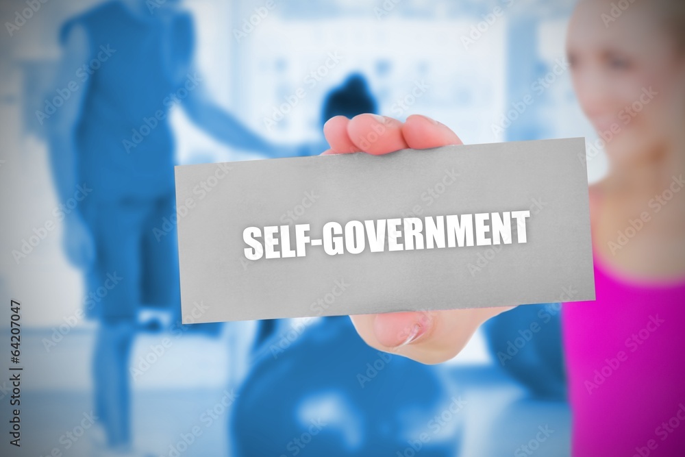 Fit blonde holding card saying self govenment Fit blonde holding card saying self govenment
