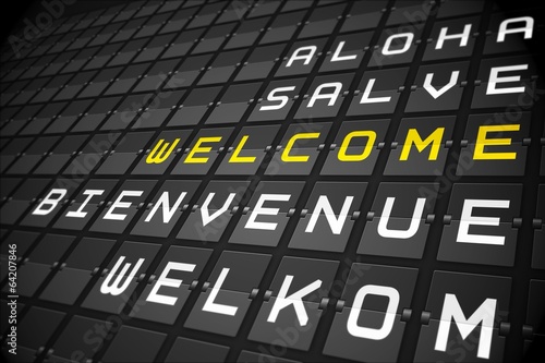 Welcome in languages on black mechanical board photo