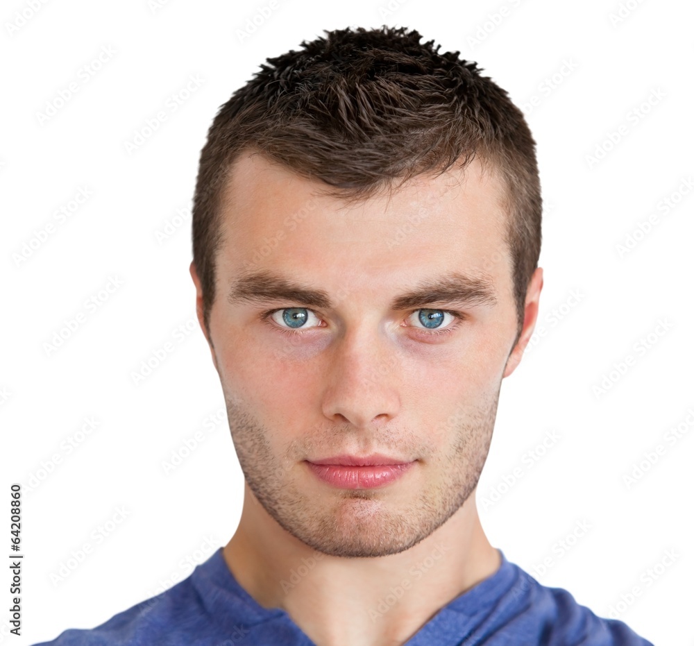 Obraz premium Serious young man looking at camera