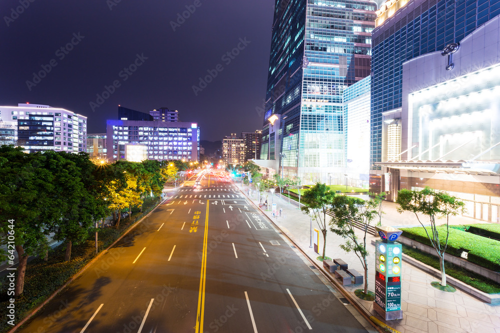 Car light trails and urban landscape in modern city