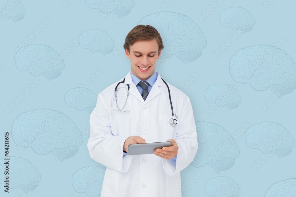 Composite image of young doctor using tablet pc Composite image of young doctor using tablet pc