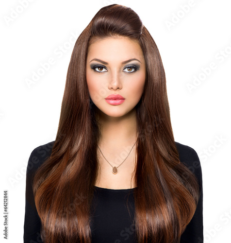 Beauty Girl Looking at Camera. Long and Shiny Brown Hair