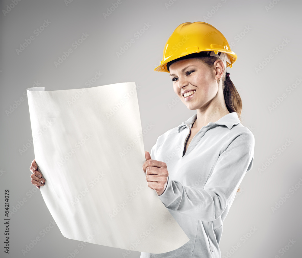 Smiling female architect holding blueprints and black folder