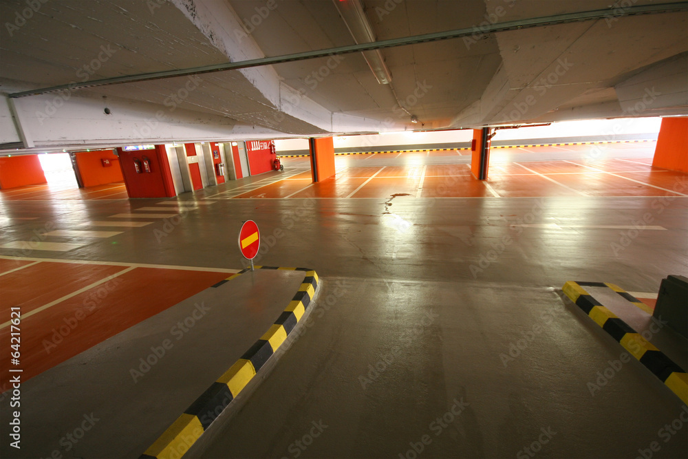 Empty parking garage with arrow for left or straight ahead