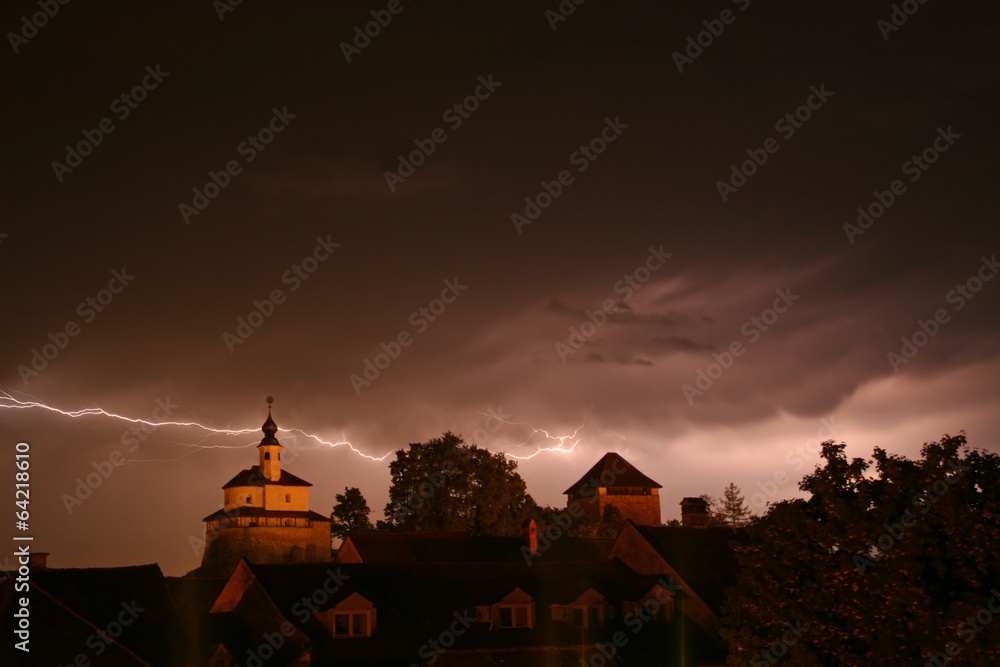 Lightning in a storm in old medival city (Kamnik, Slovenia)