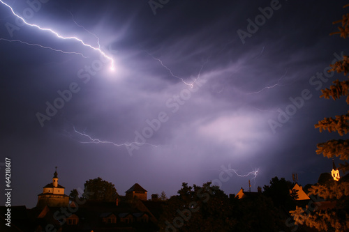 Lightning in a storm in old medival city (Kamnik, Slovenia)