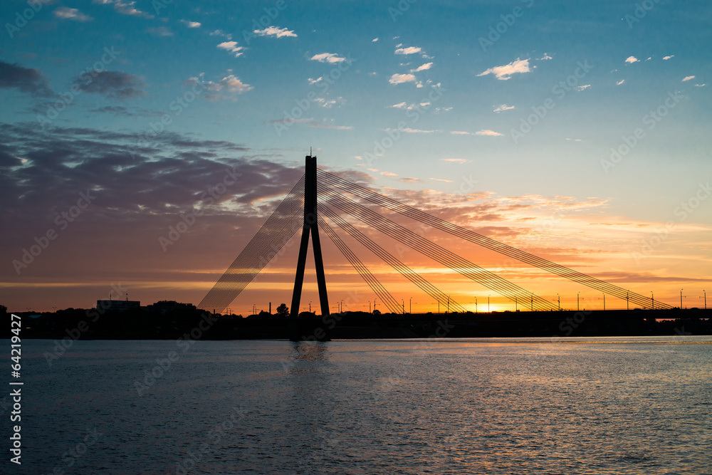 Sunset bridge river Daugava Riga