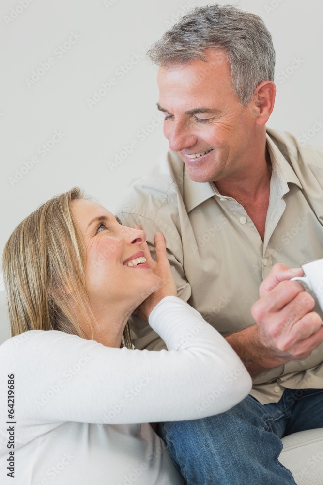 Fototapeta premium Relaxed couple with coffee cup at home