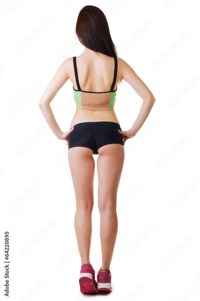 young beautiful sporty woman wearing sports stands with his back
