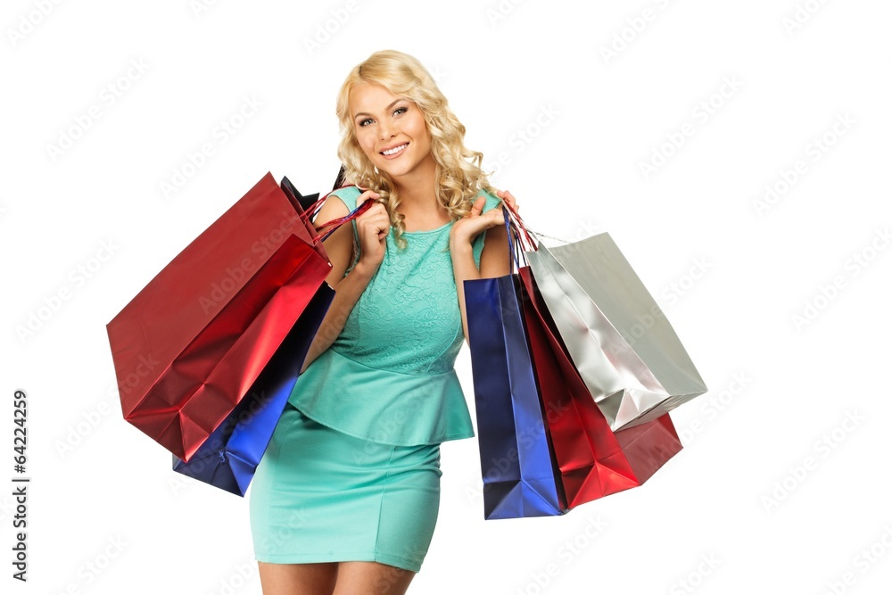 Smiling young blond woman with shopping bags Smiling young blond woman with shopping bags