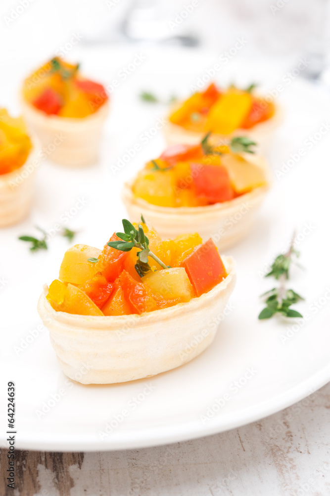 roasted vegetables with thyme in tartlets on the plate roasted vegetables with thyme in tartlets on the plate