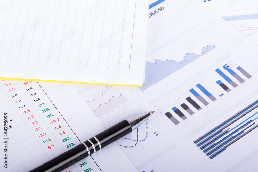 Financial Charts and Graphs on Business Table Financial Charts and Graphs on Business Table