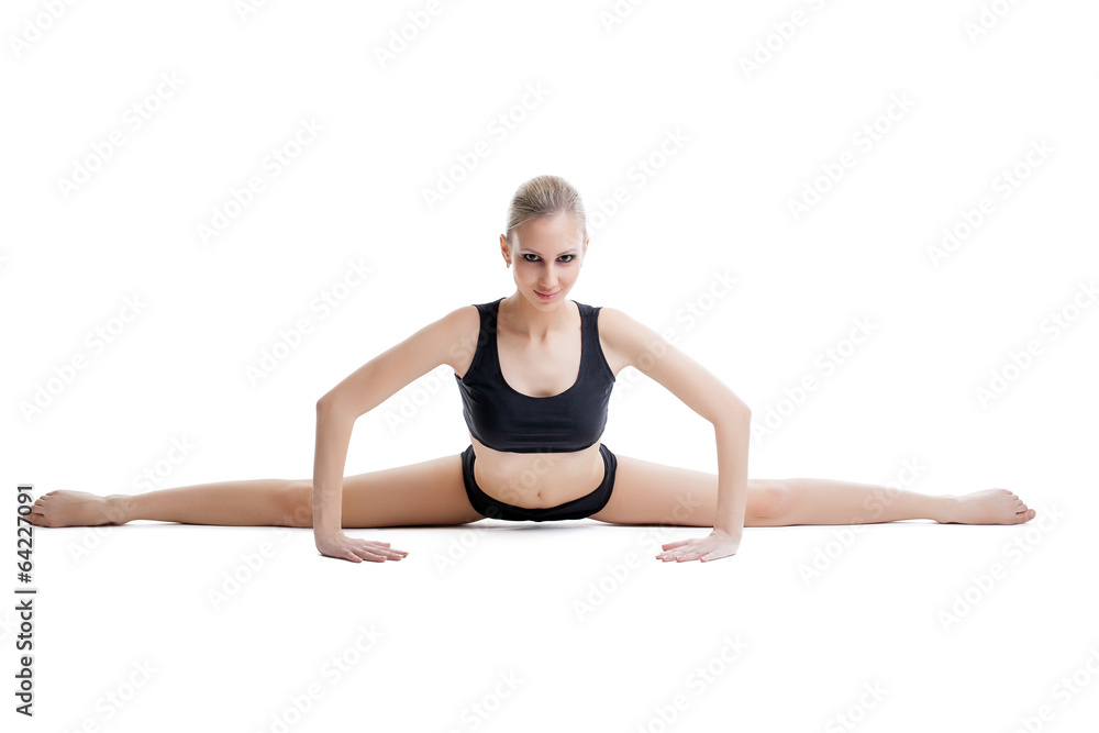 Pretty flexible woman doing stretching exercises Pretty flexible woman doing stretching exercises