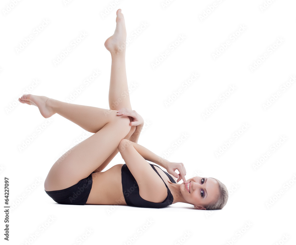 Studio shot of smiling beautiful fitness trainer Studio shot of smiling beautiful fitness trainer