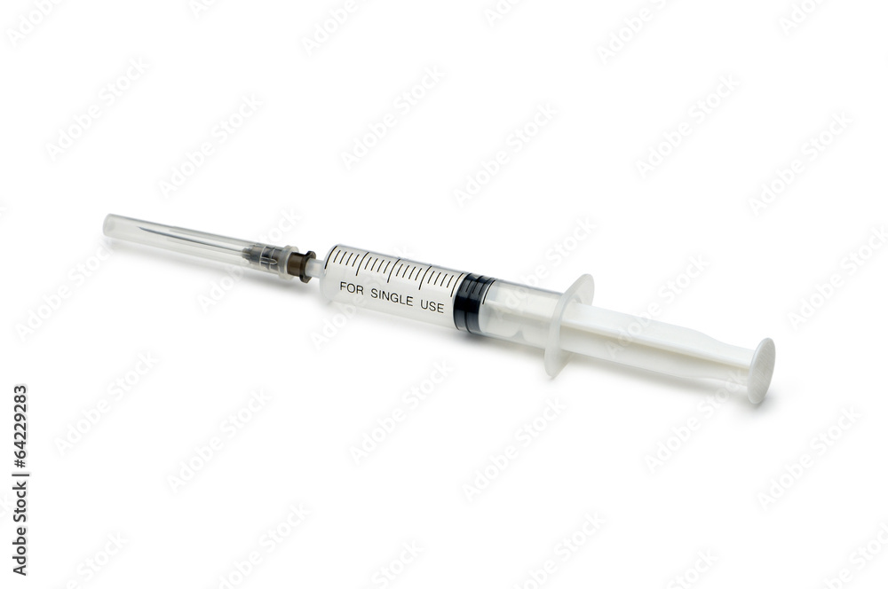 Plastic disposable syringe with a needle in the protective cap Plastic disposable syringe with a needle in the protective cap
