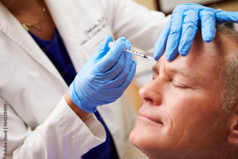 Man Receiving Cosmetic Treatment at Clinic Man Receiving Cosmetic Treatment at Clinic